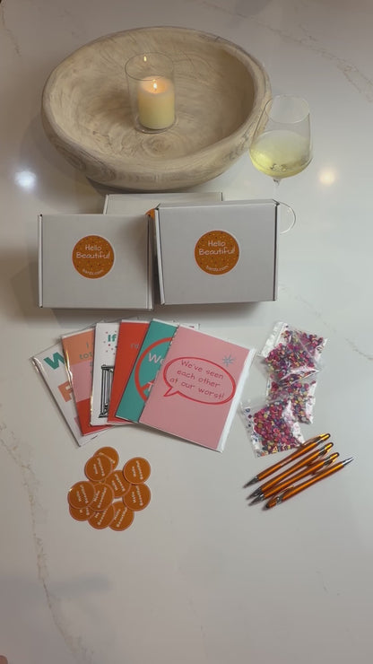 "Hands-on video demo showing someone flipping through all 6 sassy friendship cards in protective cellophane sleeves, along with BARDZ keepsake boxes, Hello Beautiful stickers, confetti, and orange pens."